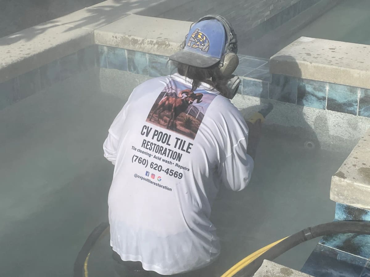Media blasting waterline tile on one of our jobs